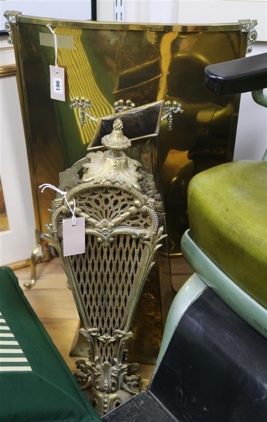 An ormolu and brass fan fire screen, a brass bowed panel fire screen and a brass coal scuttle of tapered form